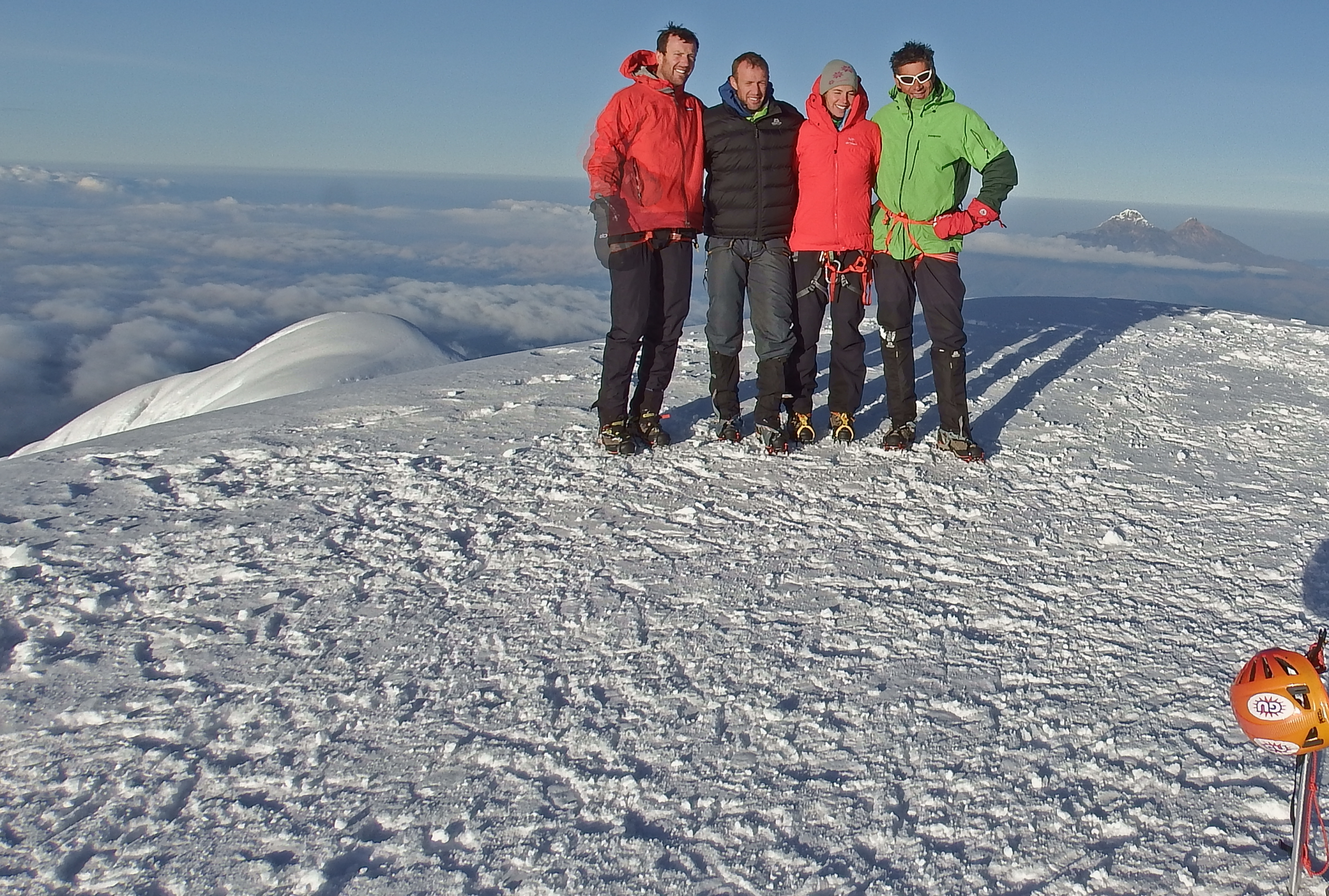 Climbers enjoying magnificent scenery from the summit of Cotopaxi.