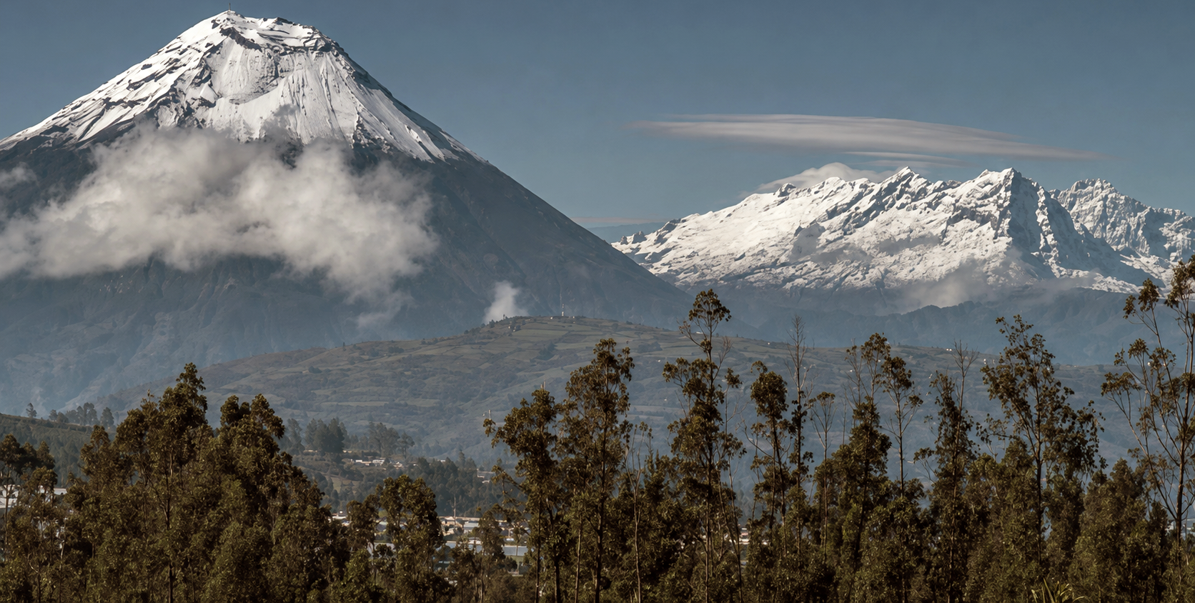 Spectacular view of the Tungurahua and El Altar volcanoes from the valleys of Ecuador